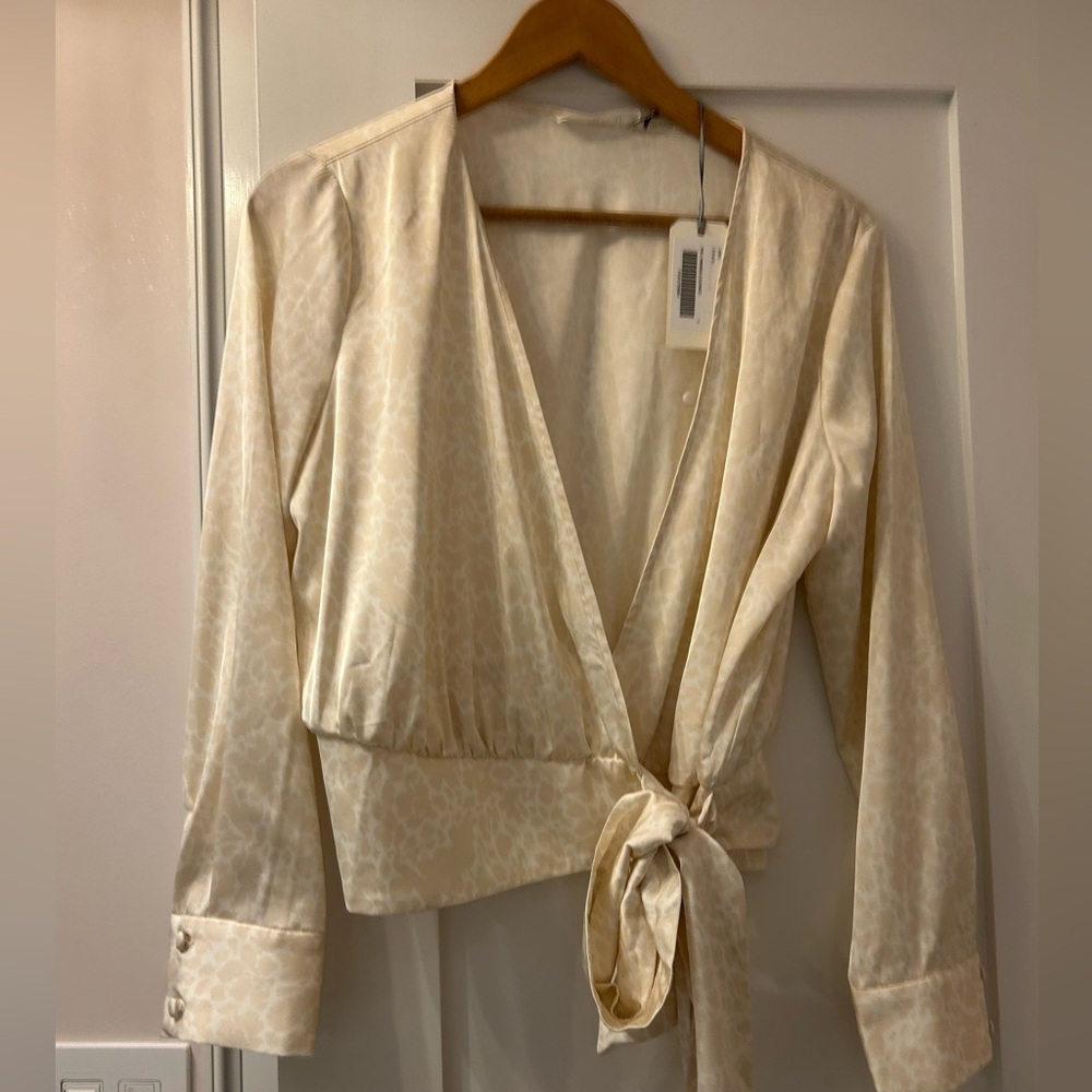 Georgie white leopard print satiny material wrap blouse. NWT. Size S